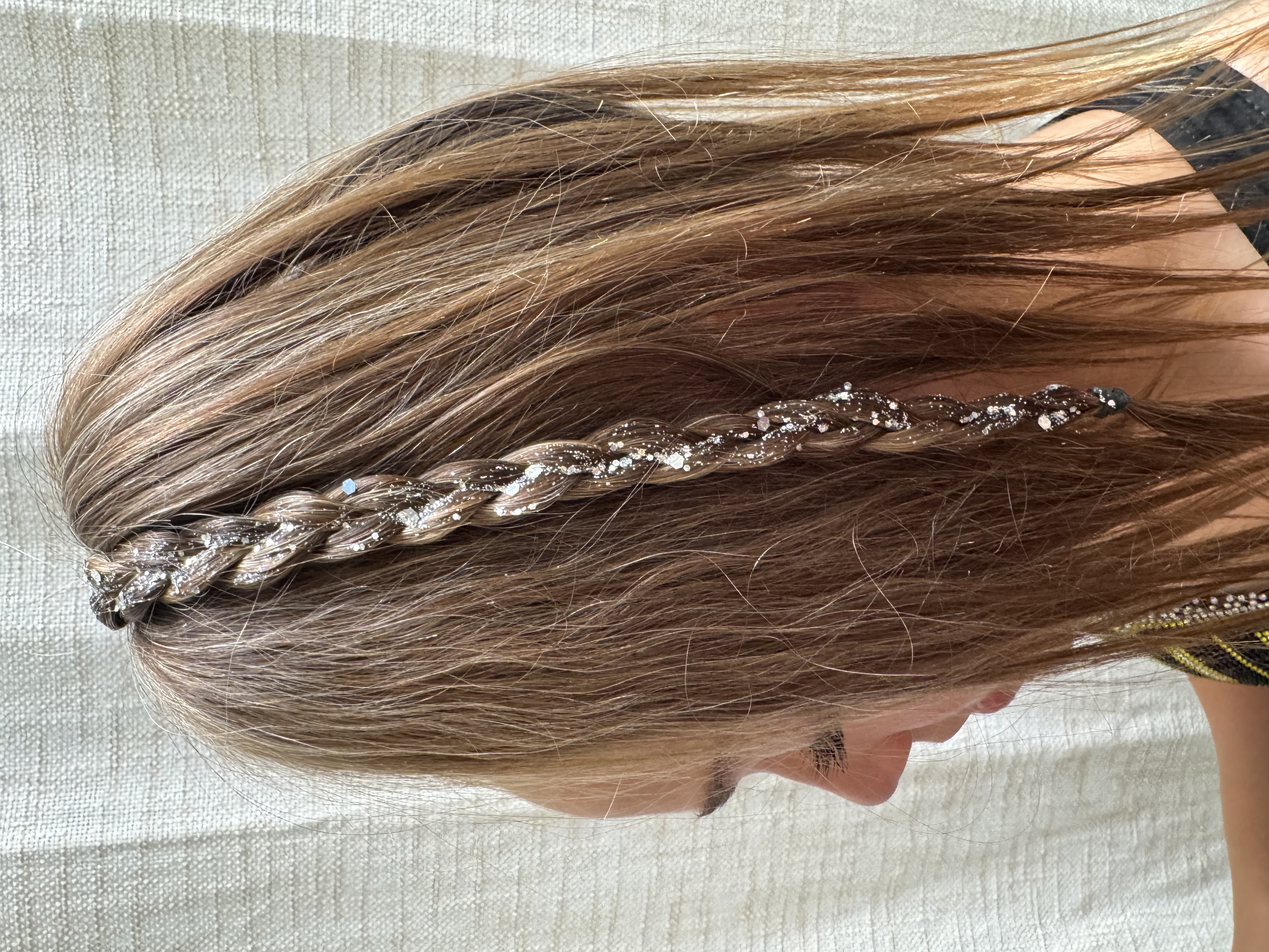 Glitter Goo applied to a ponytail